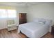 Bedroom featuring a light blue bedspread, and wood floors at 940 Virginia St # 304, Dunedin, FL 34698