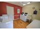Spacious laundry room with multiple white washers and dryers at 940 Virginia St # 304, Dunedin, FL 34698