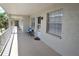 Inviting patio with bench seating, enhancing the condo's curb appeal at 940 Virginia St # 304, Dunedin, FL 34698