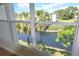 Bright water view with large window that showcases palm trees and a fountain at 940 Virginia St # 304, Dunedin, FL 34698