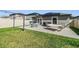 Spacious backyard featuring a patio with outdoor seating and a hammock at 11426 Sage Canyon Dr, Riverview, FL 33578
