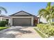 Single-Gathering home with a spacious two-car garage and a well-manicured lawn at 11426 Sage Canyon Dr, Riverview, FL 33578
