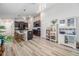 Open-concept layout showcases a modern kitchen with a large island, stainless steel appliances, and pendant lighting at 11426 Sage Canyon Dr, Riverview, FL 33578