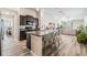 Open-concept kitchen with large island, stainless steel appliances, and seating for four at 11426 Sage Canyon Dr, Riverview, FL 33578