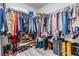 Walk-in closet with ample storage space for clothing and shoes, featuring organized racks and shelves at 11426 Sage Canyon Dr, Riverview, FL 33578