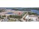 Aerial view of multi-story condos with lush greenery and water views, showcasing the community layout at 1105 Venetian Harbor Ne Dr, St Petersburg, FL 33702
