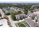 An aerial view of the property in a well-maintained community near a pond at 1105 Venetian Harbor Ne Dr, St Petersburg, FL 33702