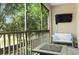 Relaxing screened balcony with a view features a cozy couch, tv, and coffee table at 1105 Venetian Harbor Ne Dr, St Petersburg, FL 33702