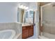 Clean bathroom featuring a glass door shower and cherry wood vanity at 1105 Venetian Harbor Ne Dr, St Petersburg, FL 33702