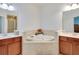 Bathroom features a soaking tub between and sinks and vanities at 1105 Venetian Harbor Ne Dr, St Petersburg, FL 33702