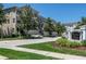 Low angle shot of the exteriors of Venetian Harbor homes with manicured lawns and tropical landscaping at 1105 Venetian Harbor Ne Dr, St Petersburg, FL 33702