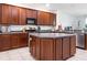 Kitchen with a large center island, ample cabinet space, and stainless steel appliances at 1105 Venetian Harbor Ne Dr, St Petersburg, FL 33702