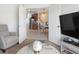 The living space offers a view of the dining room and kitchen through white double doors for an open-concept feel at 1105 Venetian Harbor Ne Dr, St Petersburg, FL 33702