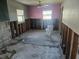 Bathroom renovation in progress, showcasing exposed studs and a partially installed toilet at 125 18Th Nw St, Ruskin, FL 33570