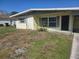 Charming one-story home with a well-maintained lawn and blooming flowers in the front yard at 125 18Th Nw St, Ruskin, FL 33570