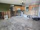 Spacious kitchen awaiting renovation, featuring wooden cabinets and ample room for customization at 125 18Th Nw St, Ruskin, FL 33570