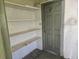 Storage room with built in shelves and a closed door at 125 18Th Nw St, Ruskin, FL 33570