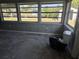 Bright sunroom featuring large windows with views of the channel and canal at 125 18Th Nw St, Ruskin, FL 33570