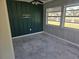 Enclosed room, ready for renovation, features a calming view of the water at 125 18Th Nw St, Ruskin, FL 33570