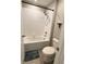 Clean bathroom featuring a white tub-shower combination and tiled walls at 12717 Lemon Pepper Dr, Riverview, FL 33578