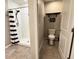 Bathroom featuring a walk-in shower, a toilet area with decorative wall art at 12717 Lemon Pepper Dr, Riverview, FL 33578