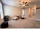 Bedroom with ceiling fan and ample closet space at 12717 Lemon Pepper Dr, Riverview, FL 33578