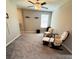 Bedroom with ceiling fan and rocking chair at 12717 Lemon Pepper Dr, Riverview, FL 33578