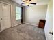 Bedroom featuring neutral carpet, a ceiling fan and natural light at 12717 Lemon Pepper Dr, Riverview, FL 33578