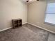 Bedroom with neutral walls, carpet, ceiling fan, and a window for natural light at 12717 Lemon Pepper Dr, Riverview, FL 33578