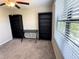 Bedroom featuring a desk and shelving, neutral carpet, and natural light at 12717 Lemon Pepper Dr, Riverview, FL 33578