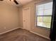 Bedroom with large window at 12717 Lemon Pepper Dr, Riverview, FL 33578