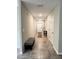 Entryway hallway featuring tiled floors and neutral paint at 12717 Lemon Pepper Dr, Riverview, FL 33578