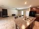 Eat in kitchen with dark wood cabinets and stainless steel appliances at 12717 Lemon Pepper Dr, Riverview, FL 33578
