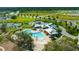 A Primary-planned community features a community pool, tennis courts, and lush greenery at 12965 Satin Lily Dr, Riverview, FL 33579