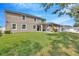 Large fenced backyard with a covered patio and outdoor gazebo, perfect for relaxation and entertainment at 12965 Satin Lily Dr, Riverview, FL 33579