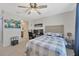 Bedroom featuring a comfy bed, desk, and shelving, perfect for relaxation or work at 12965 Satin Lily Dr, Riverview, FL 33579
