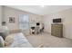 Functional bedroom with a daybed, desk, and storage, perfect for a home office or guest room at 12965 Satin Lily Dr, Riverview, FL 33579
