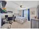 Comfortable bedroom with a desk, shelving, and soft lighting, creating a cozy and productive space at 12965 Satin Lily Dr, Riverview, FL 33579