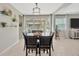Dining room with chandelier and large sliding glass doors with outdoor view at 12965 Satin Lily Dr, Riverview, FL 33579