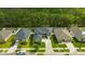 Beautiful two-story home with a well-manicured lawn and driveway, nestled in a quiet neighborhood surrounded by trees at 12965 Satin Lily Dr, Riverview, FL 33579
