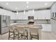 Modern kitchen with granite countertops, stainless steel appliances, a center island, and stylish pendant lighting at 12965 Satin Lily Dr, Riverview, FL 33579