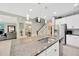 Open concept kitchen with granite countertops, stainless steel appliances, island with barstool seating and great natural light at 12965 Satin Lily Dr, Riverview, FL 33579