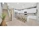 Bright kitchen with stainless steel appliances, granite counters, and island seating at 12965 Satin Lily Dr, Riverview, FL 33579