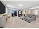 Open concept living room flowing into the dining room and office, featuring stylish decor and natural light at 12965 Satin Lily Dr, Riverview, FL 33579
