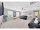 Spacious upstairs living room with plush carpet and plenty of natural light at 12965 Satin Lily Dr, Riverview, FL 33579
