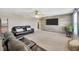 Upstairs living room with wood accent wall and plush carpet at 12965 Satin Lily Dr, Riverview, FL 33579