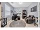 Home office with desk, comfortable seating, and neutral color scheme at 12965 Satin Lily Dr, Riverview, FL 33579