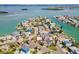 An expansive aerial view showcases the home's waterfront community, offering a relaxed and convenient coastal lifestyle at 13098 Boca Ciega Ave, Madeira Beach, FL 33708