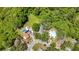 Aerial view showing a home's location within a community, with a large yard and pool area, and mature trees at 1444 Oak Haven Dr, Safety Harbor, FL 34695