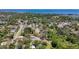 This aerial photo showcases a community with homes nestled among trees and green spaces, with waterfront views at 1444 Oak Haven Dr, Safety Harbor, FL 34695